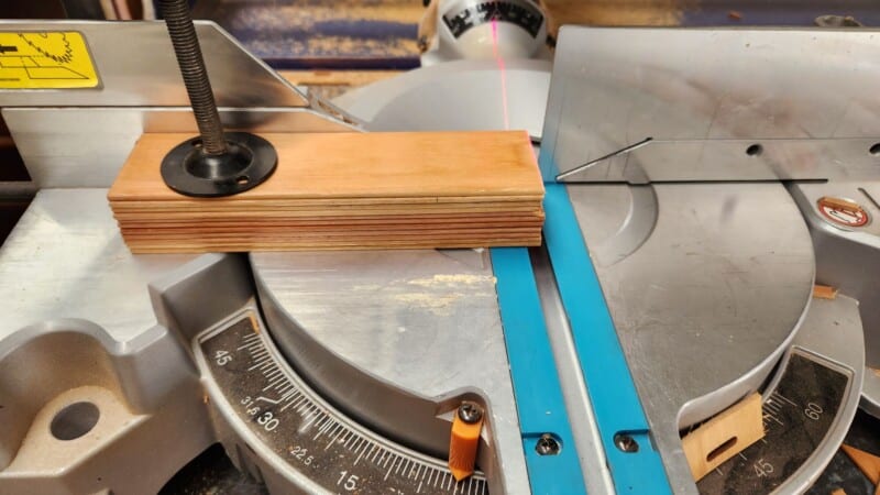 stack blinds clamped to mitre saw