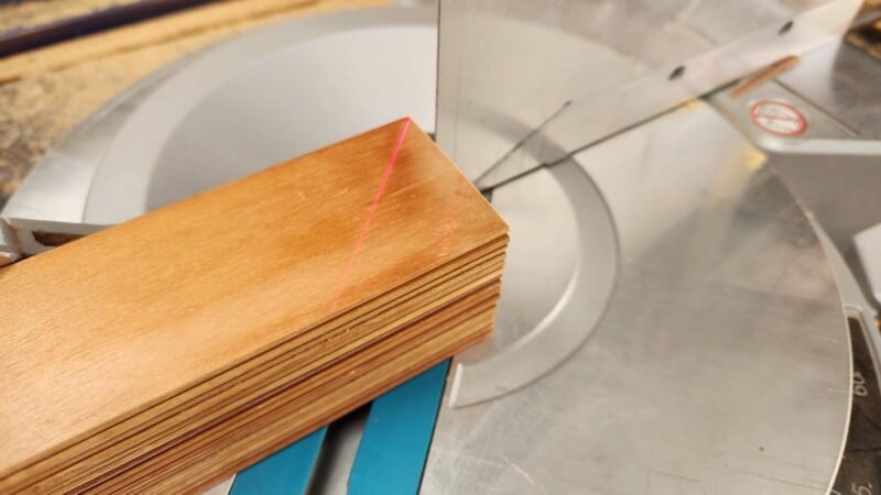 stack blinds clamped to mitre saw cut at 45 degrees