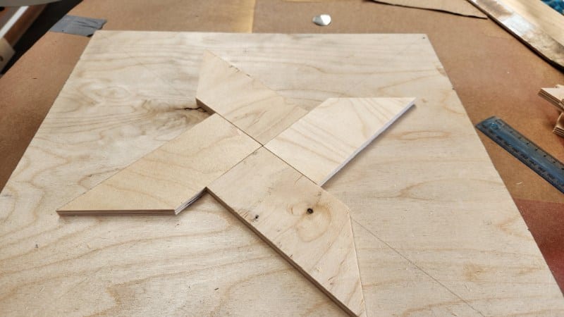 Wooden star cut from scrap plywood ready for painting