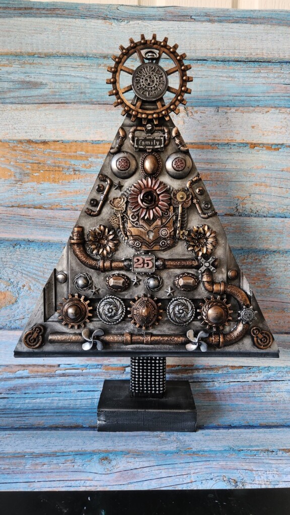 Wooden Christmas tree decorated with recycled jewellery