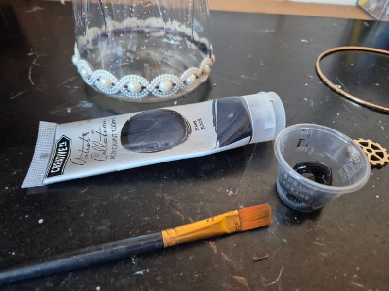 Painting the bottle with black paint