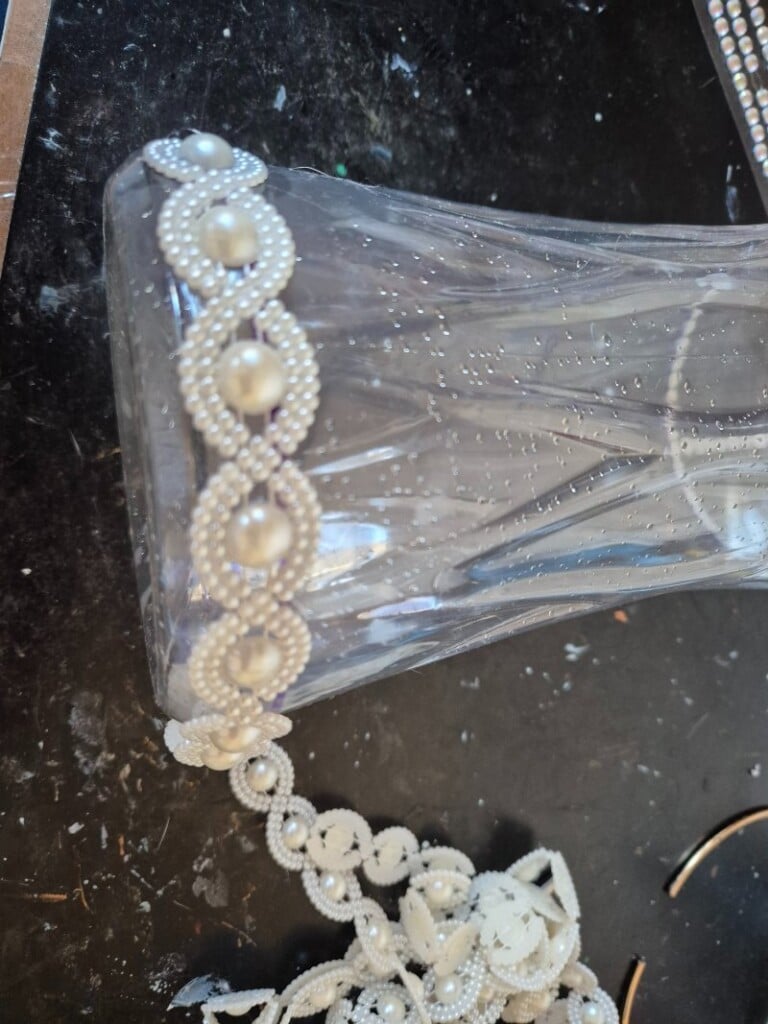 wrapping string beads around the bottom