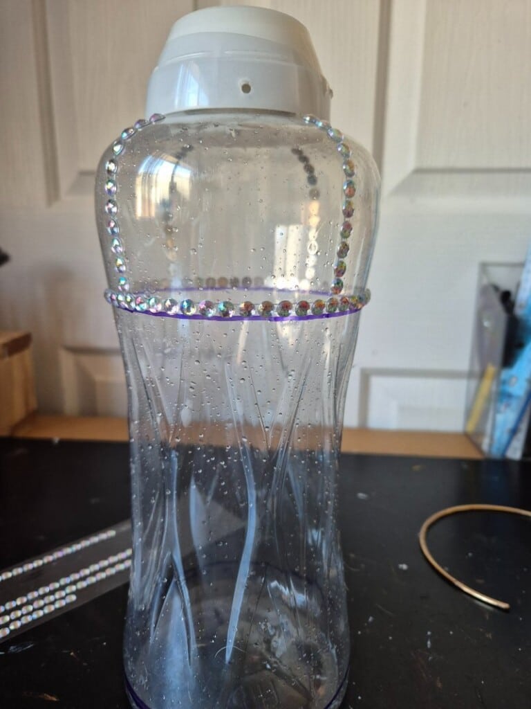adding self adhesive beads to bottle