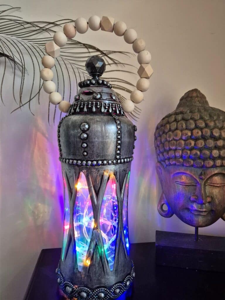 Lantern made from downy bottle with lights and beads