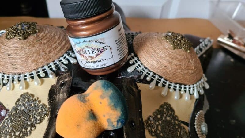 Metallic rust paint for charms inside corset
