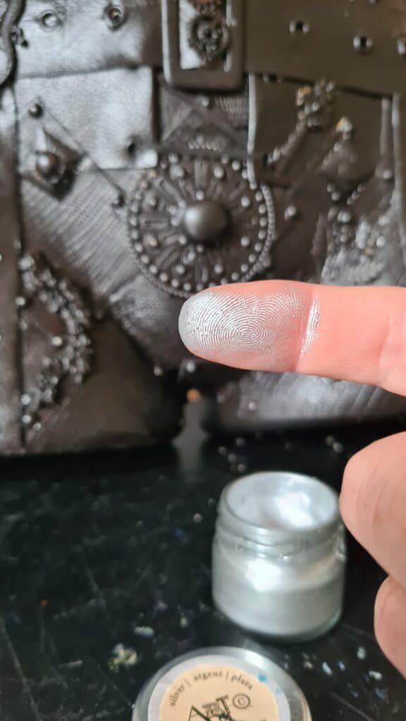 finger showing how much wax to use