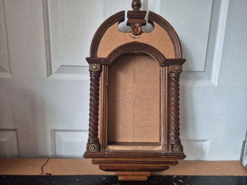 Front panel of clock removed and centre cut out