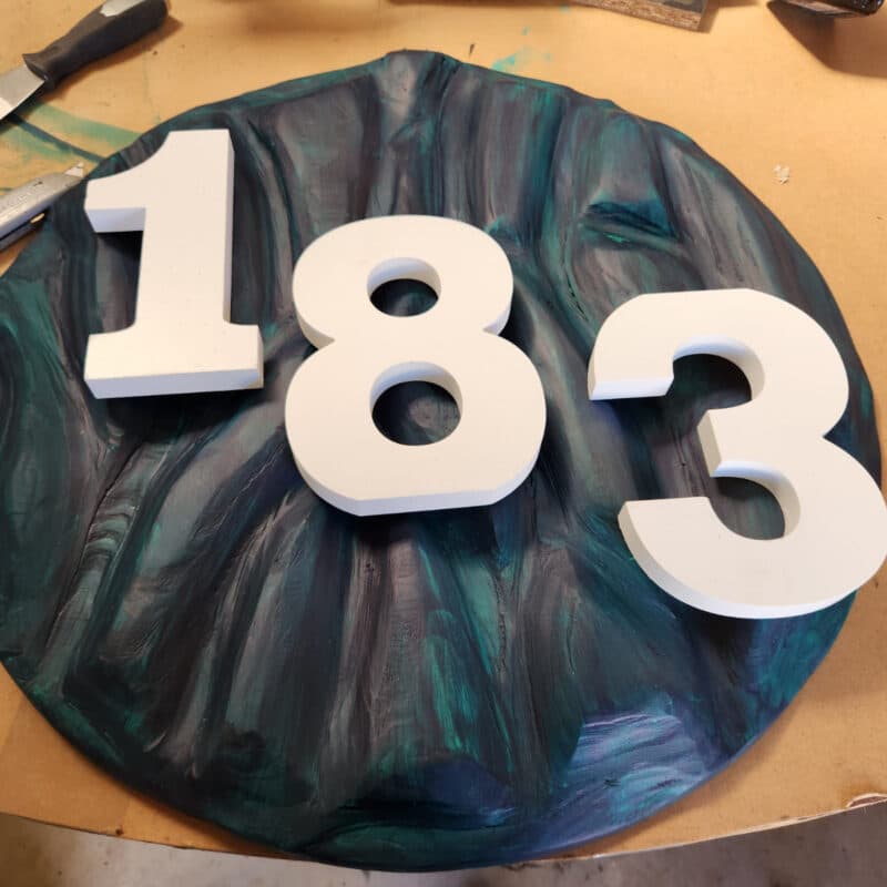 adding house numbers to textured wood