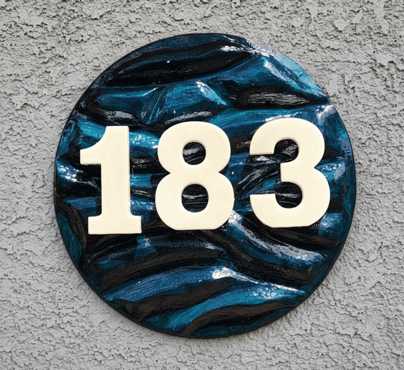 house number with texture carved into the surface