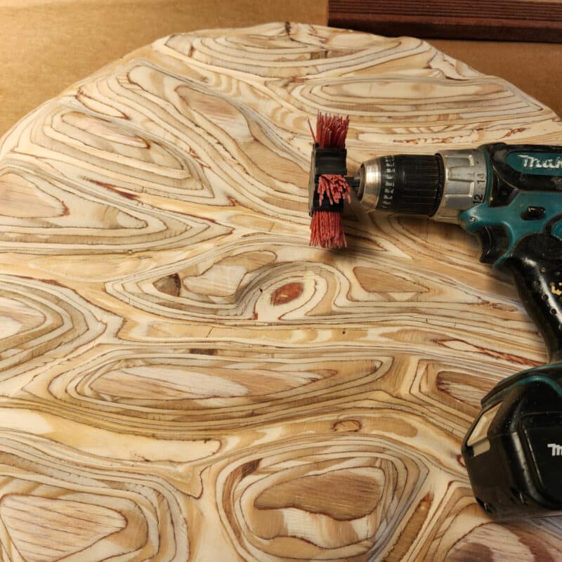 coarse nylon brush attached to a drill