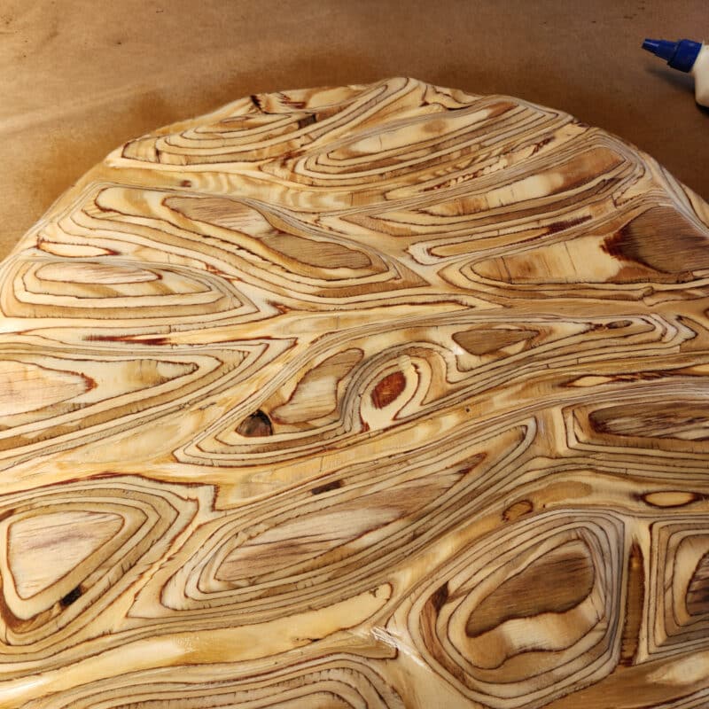 textured wood surface sprayed with water
