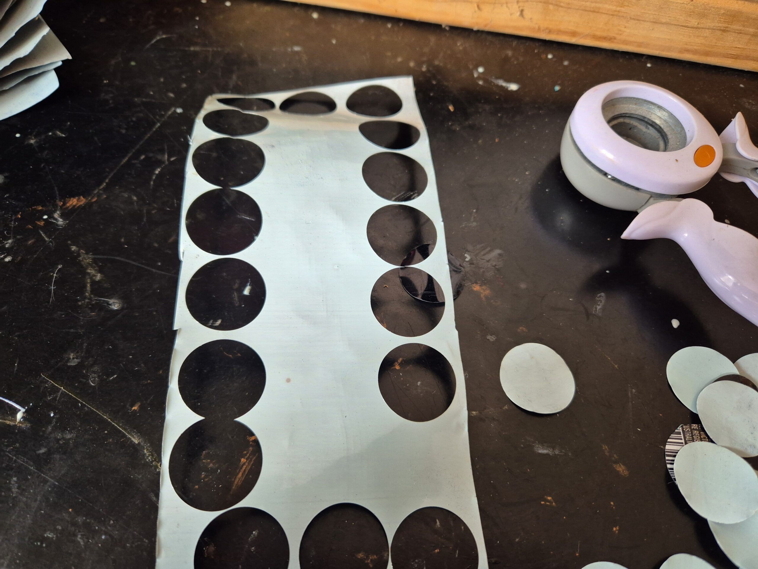 circles punched out of aluminium can