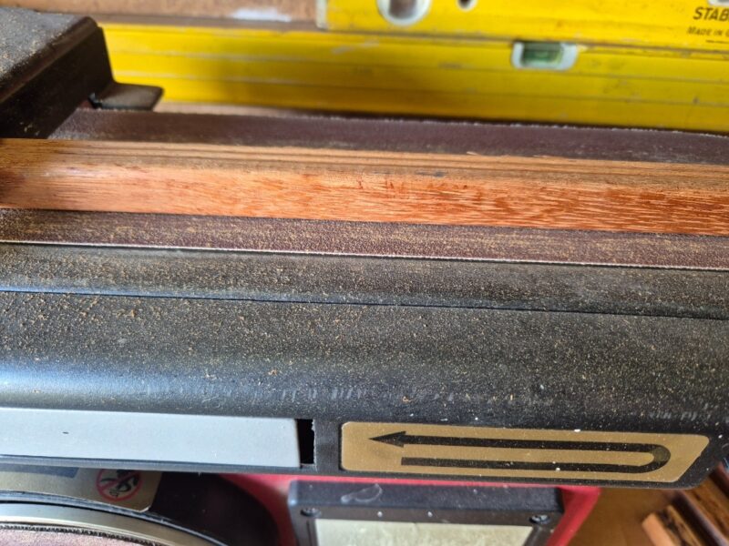 sanding edges on a benchtop sander
