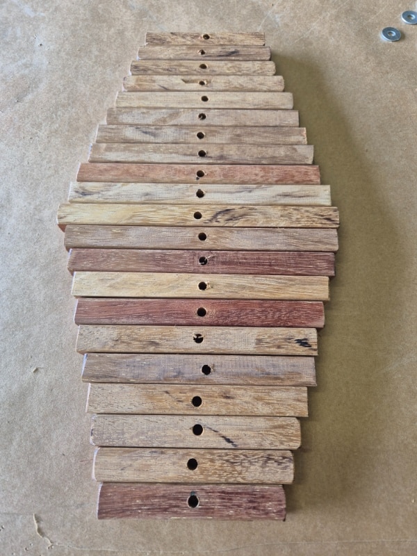 wood pieces cut to size with holes drilled
