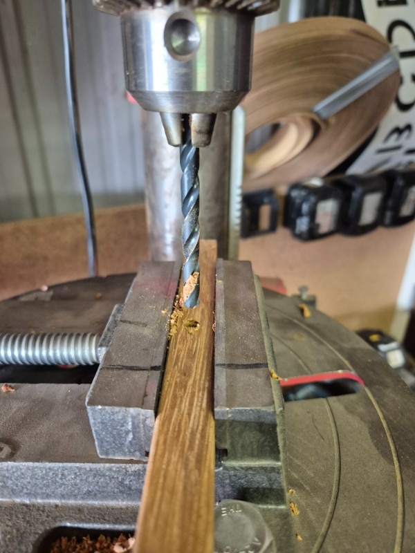 using a drill press to drill holes