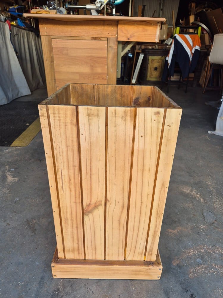 old stain and varnish sanded off the wooden planter
